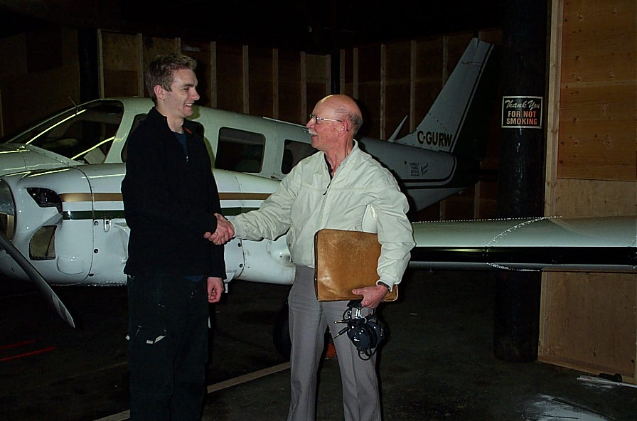 Tim Sawatzky receives congratulations from Pilot Examiner Donn Richardson after the completion of Tim's Multi-engine Class Rating Flight Test. Langley Flying School.