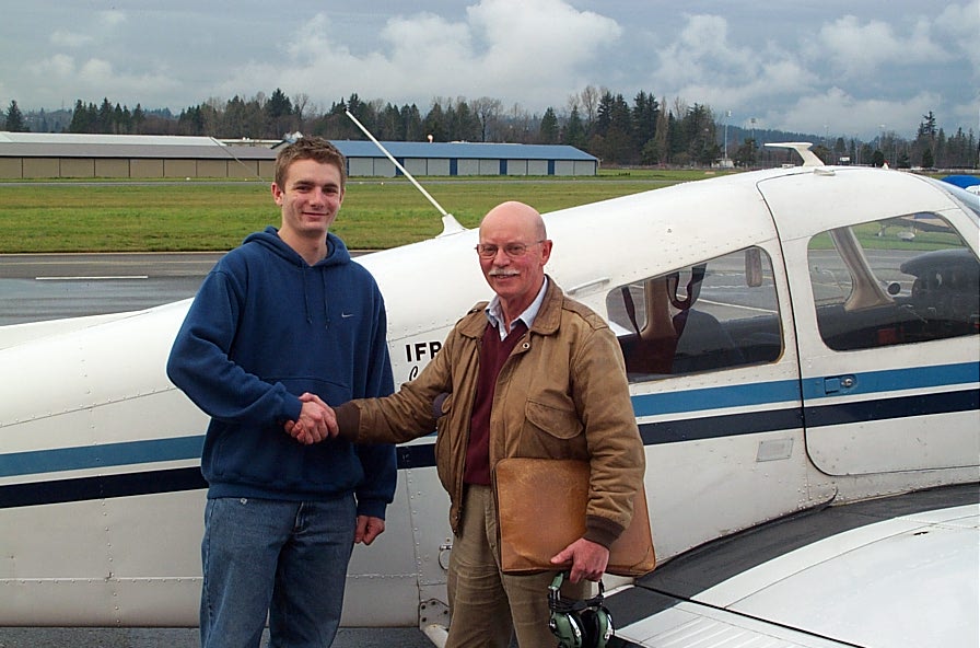 Commercial Pilot Graduate Tim Sawatzky with Pilot Examiner Donn Richardson after the successful completion of Tim's Commerical Pilot Flight Test.  Langley Flying School.