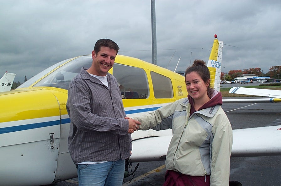 Tony McHale with Flight Instructor Naomi Jones, after completing his First Solo Flight on October 1, 2007. Langley Flying School.