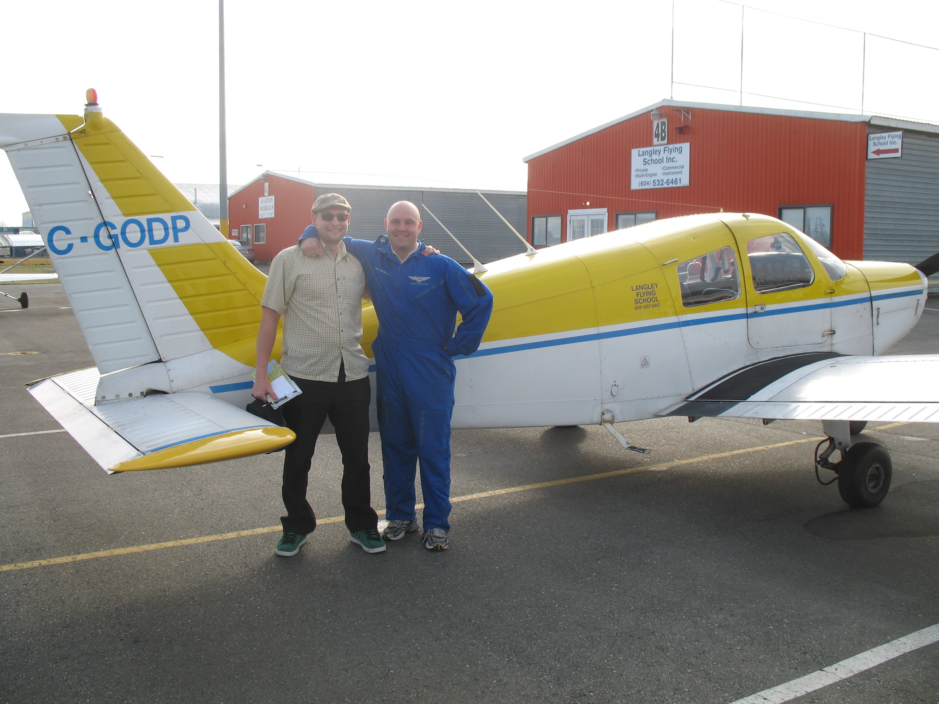 Will Tuokkola with Flight Instructor Rod Giesbrecht after the completion of Will's First Solo Flight in Cherokee GODP on April 23, 2009.  Langley Flying School.