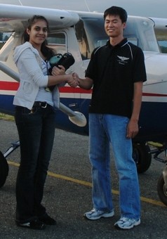 Yashwaree Gopy with her Flight Instructor Hoowan Nam after the successful completion of Yashwaree's Private Pilot Flight Test on July 18, 2009, Langley Flying School.