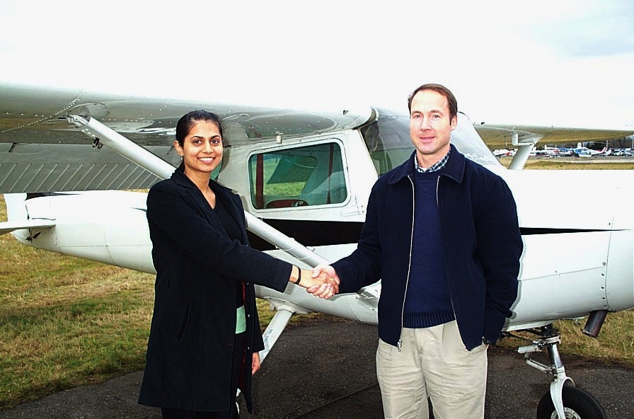 Sukhmani Brar receives congratulations form Pilot Examiner Jeff Durrand after the successful completion of Sukhmani's Commercial Pilot Flight Test on December 21, 2008 in Cessna GPUK. Langley Flying School.