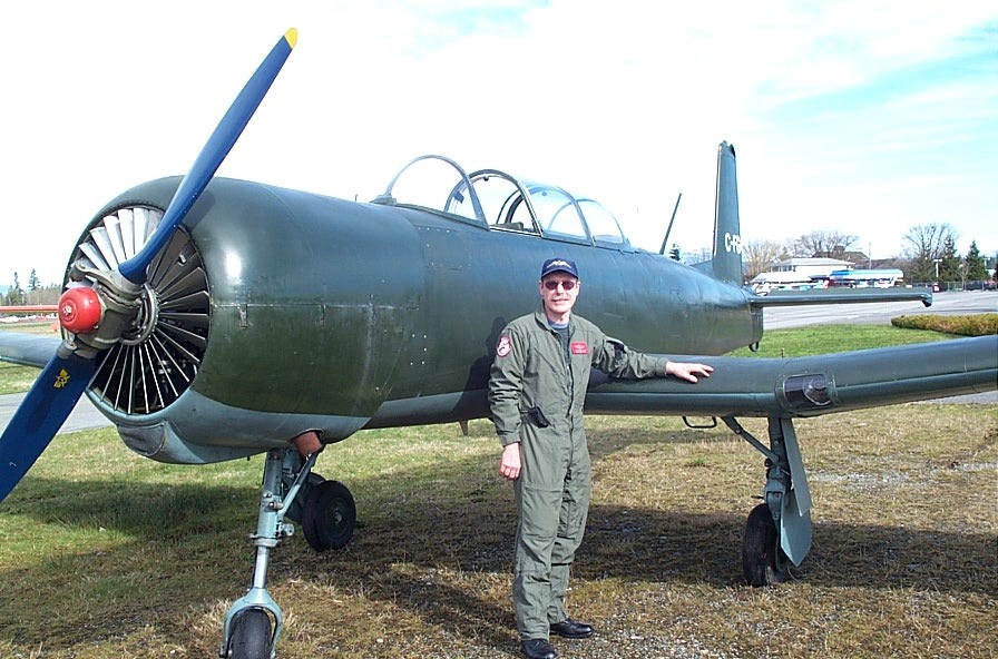 Flight Instructor Peter Waddington with his Nanchang. Langley Flying School