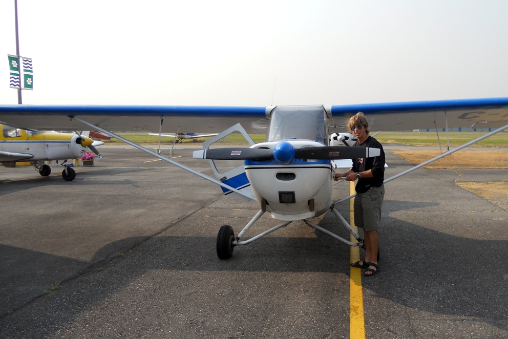 Darren Kroeker with His Champ on wheels in front of Langley Flying School.
