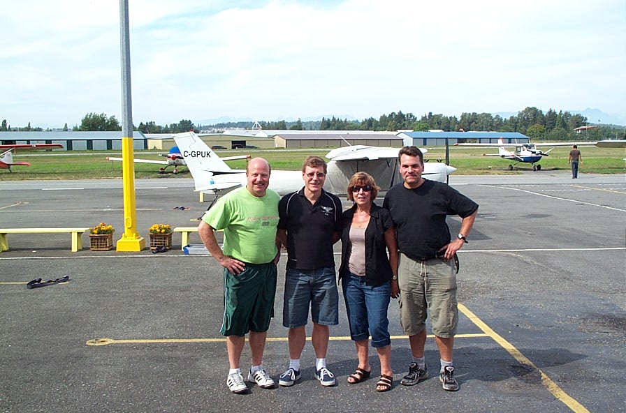 Nick Van Empel (right) with Langley Flying School staffers:  Rita Methorst, Peter Waddington, and Dave Parry.