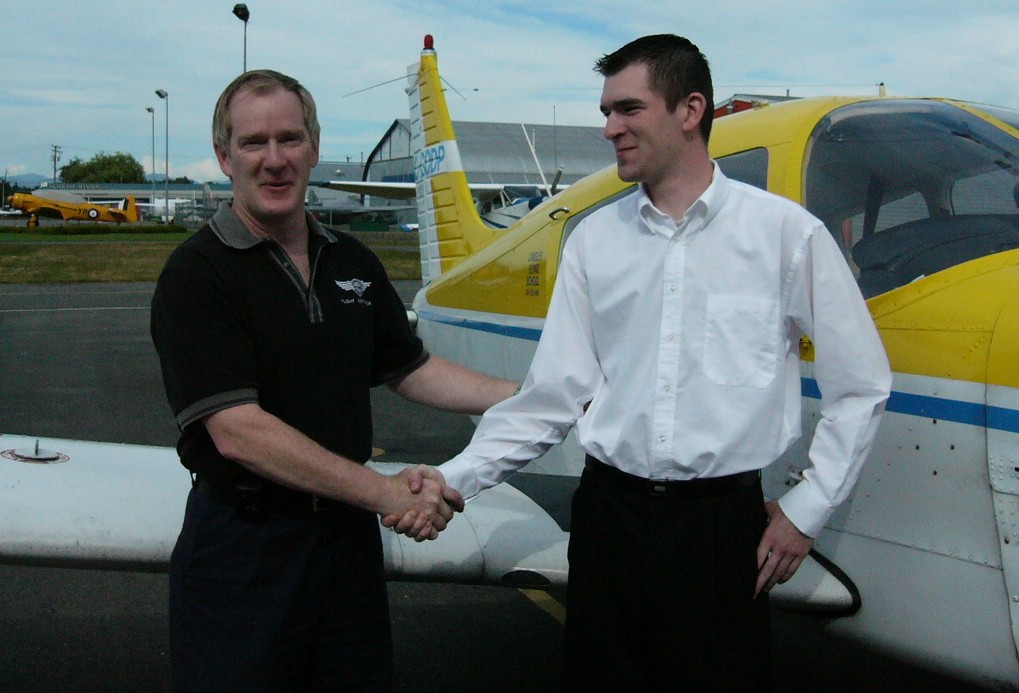 Tom and Sean Larkin on the occasion of Sean's successfully completion of his professional pilot qualifications in 2004.  Langley Flying School.
