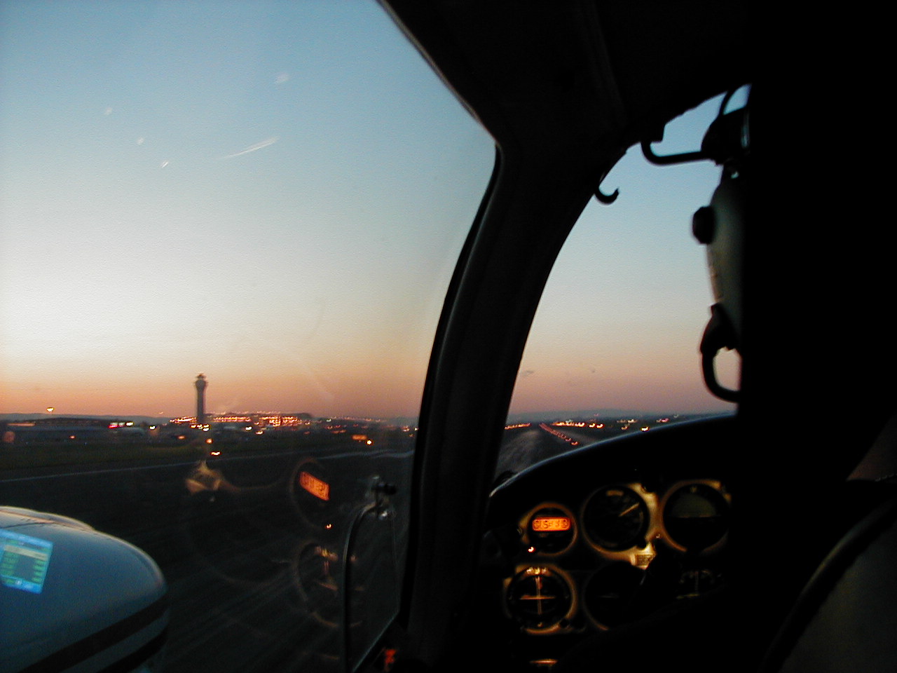 Langley Flying School's Piper Seneca during a twilight departure from Portand International Airport