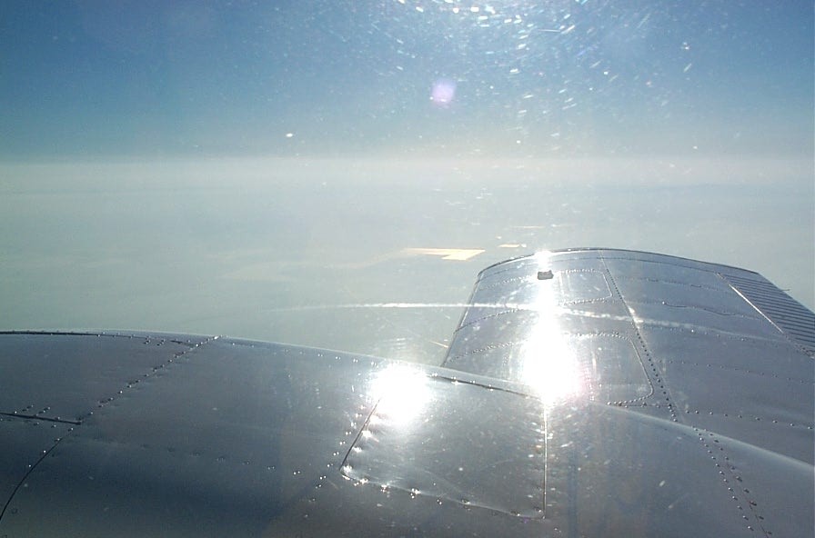 Above the haze in California in Langley Flying School's Piper Seneca.