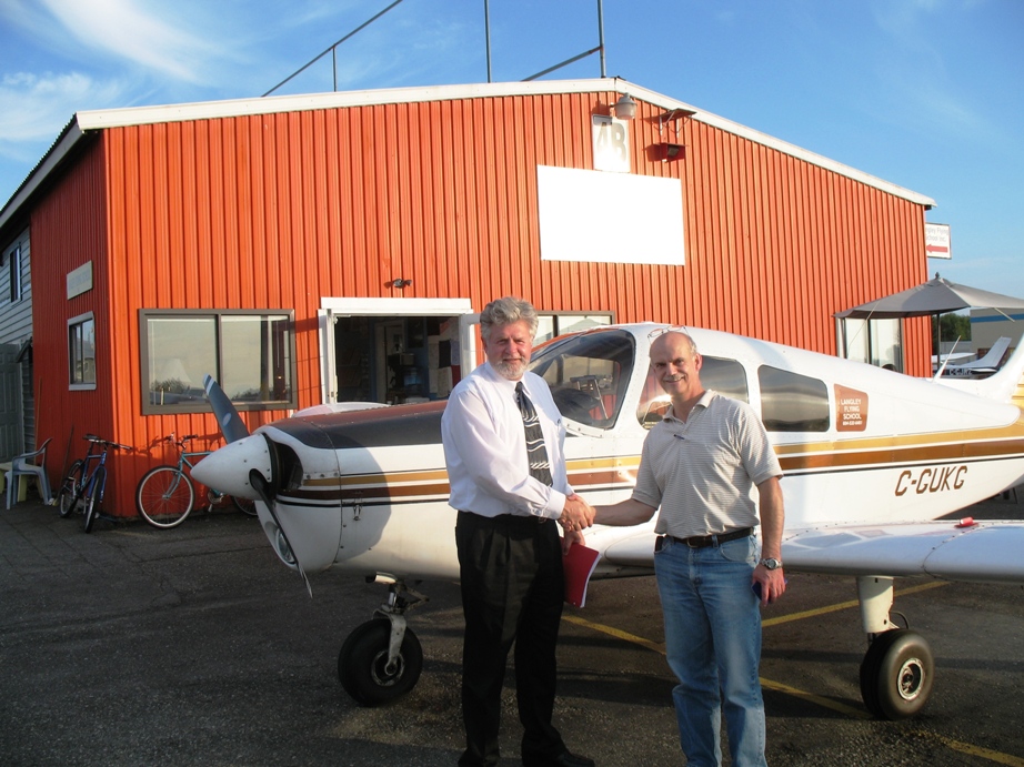 Alan March with Pilot Examiner Paul Harris.