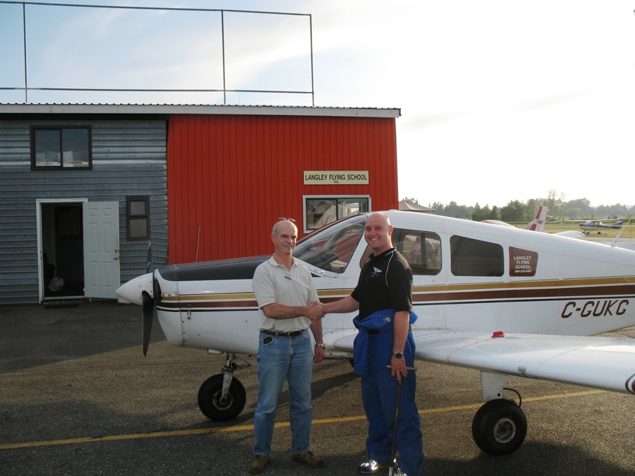 Private Pilot Graduate Alan March with Flight Instructor Rod Giesbrecht after the completion of Alan's Flight Test on July 15, 2009.  Langley Flying School.