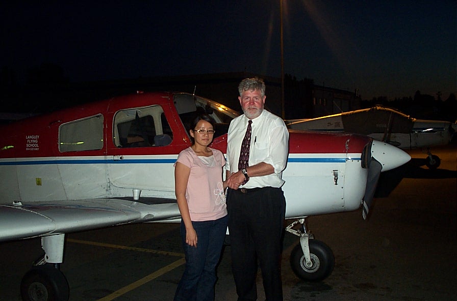 Chien-Ju (Ruby) Chou with Pilot Examiner Paul Harris after the successful completion of Ruby's Private Pilot Flight Test on August 12, 2008.  Langley Flying School.