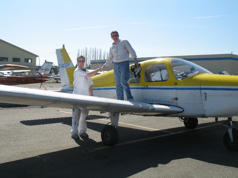 Dave Marshall is congratulated by Flight Instructor Phil Craig after the successful completion of his First Solo Flight on April 7, 2009.  Langley Flying School.