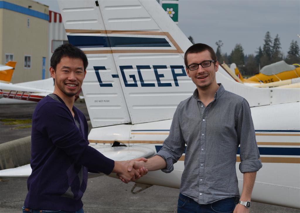 Private Pilot Florian James is congratulated by his Flight Instructor, Nam Vu, after the successful completion of Florian's Flight Test on April 23, 2011.  Langley Flying School.