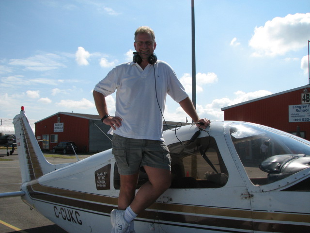 Kevin Mickeby on the wing of Cherokee GUKG after completing his First Solo Flight on August 4, 2007.  Langley Flying School.