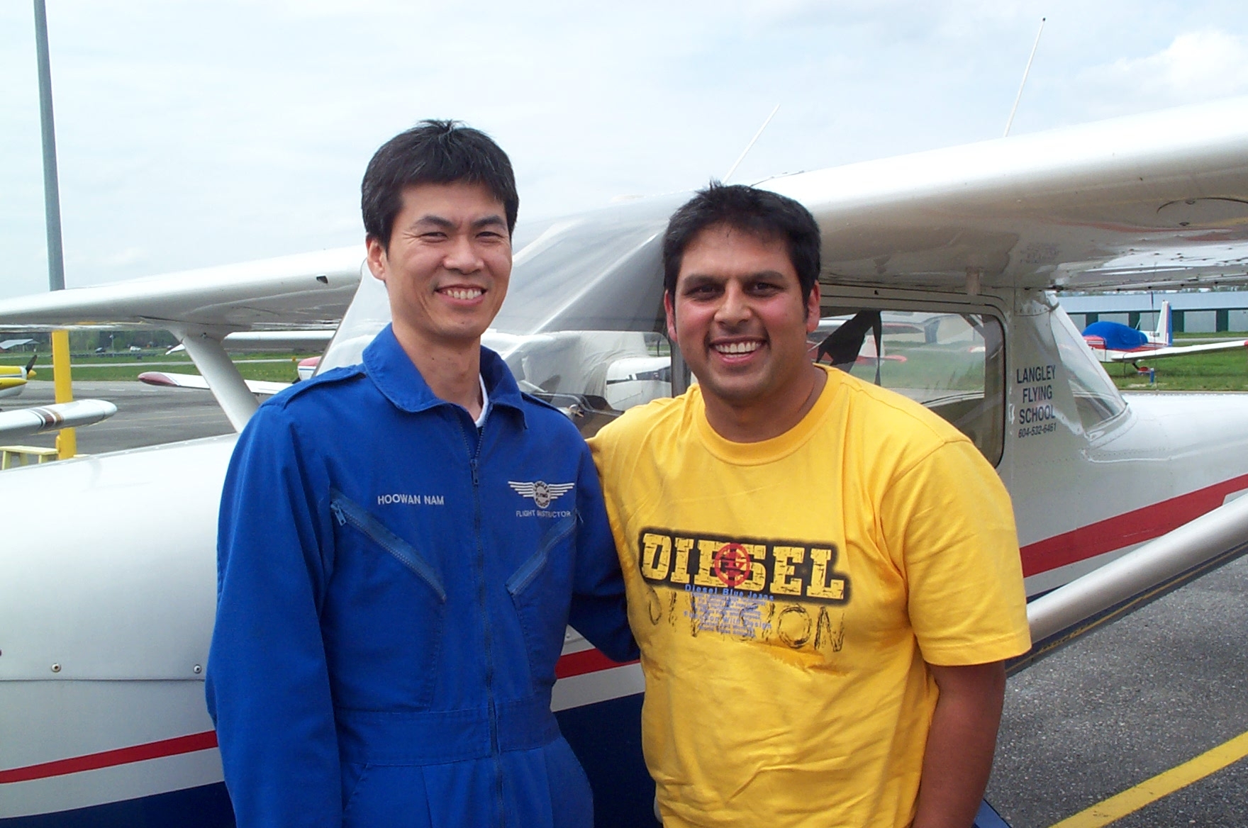 Michael Fernando with his Flight Instructor, Hoowan Nam, after the completion of Michael's First Solo Flight on April 23, 2010.  Langley Flying School.