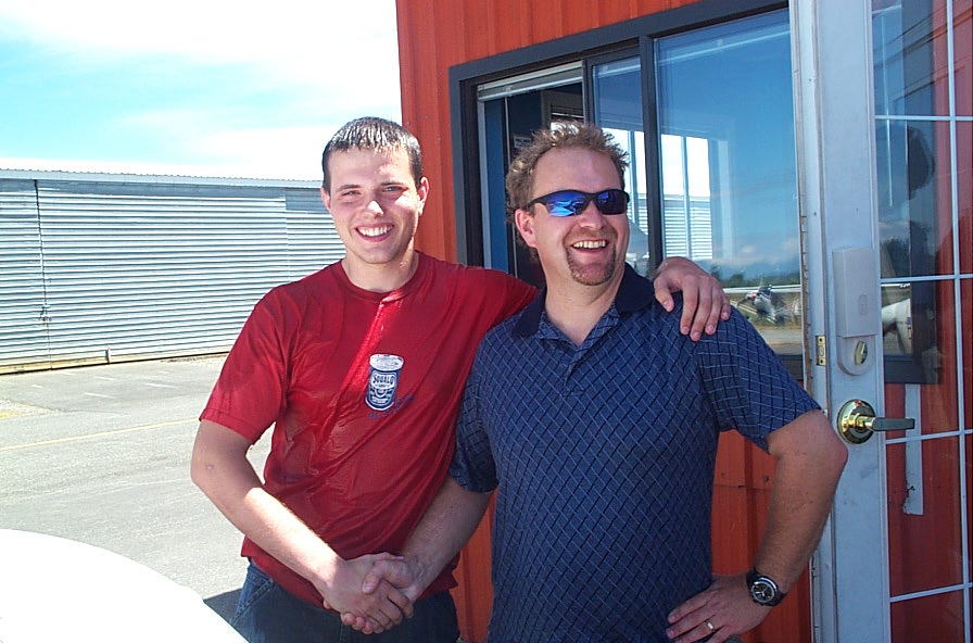 Ryan Fielding with Flight Instructor Dave Page after the completion of Ryan's First Solo Flight on July 21, 2008 in Piper Cherokee GODP.  Langley Flying School.