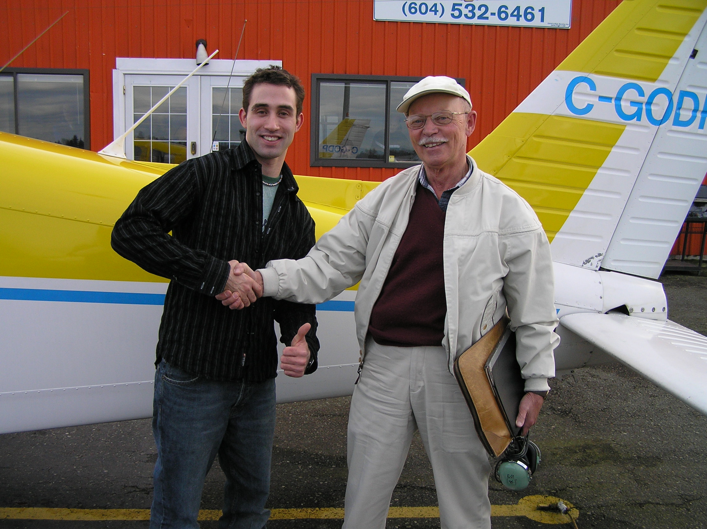 Shadrin Storness-Bliss with Pilot Examiner Donn Richardson after the successful completion of Shad's Private Pilot Flight Test. Langley Flying School. 