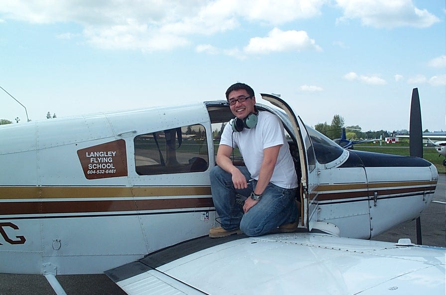 Sean Yoo on the wing of Cherokee GUKG after completing his First Solo Flight on May 9, 2008.  Langley Flying School.