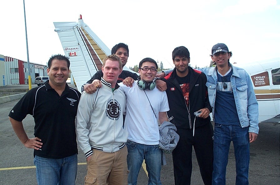 Sean Yoo with Flight Instructor Matt Robic (left) and fellow students.  Langley Flying School.