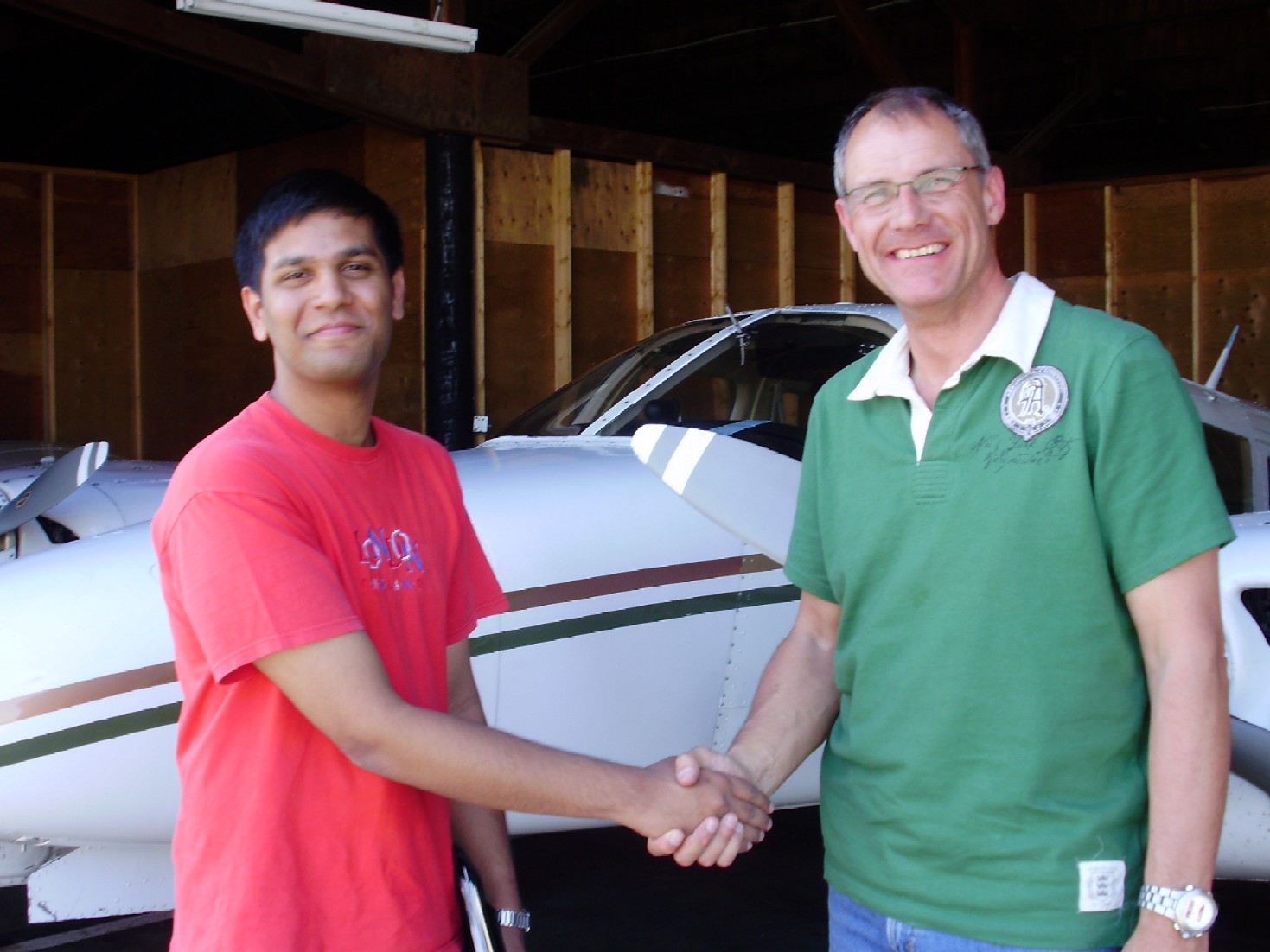 Commercial Pilot Suraj Canakapalli is congratulated by Pilot Examiner Matt Edwards after the successful completion of Suraj's Multi-engine Class Rating Flight Test on June 2, 2009.  Congrats also to Suraj's Flight Instructor Philip Craig.  Langley Flying School.