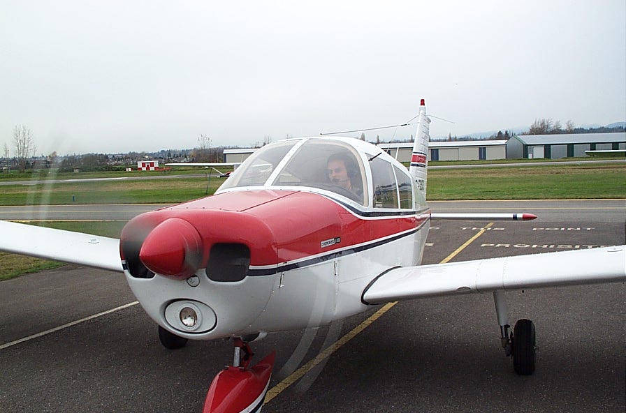Zenon Garnett taxies in his aircraft, Piper Cherokee GDGS after completing his First Solo Flight on November 14, 2008.  Langley Flying School.