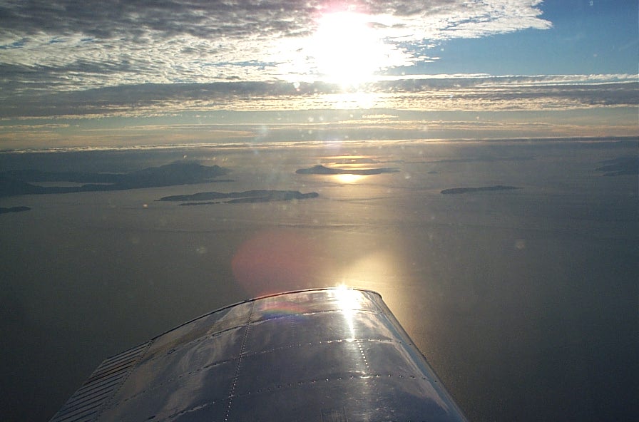 Wing of Cherokee GUKG over the Strait of Georgia during trianing flight.  December 3, 2008.  Langley Flying School.