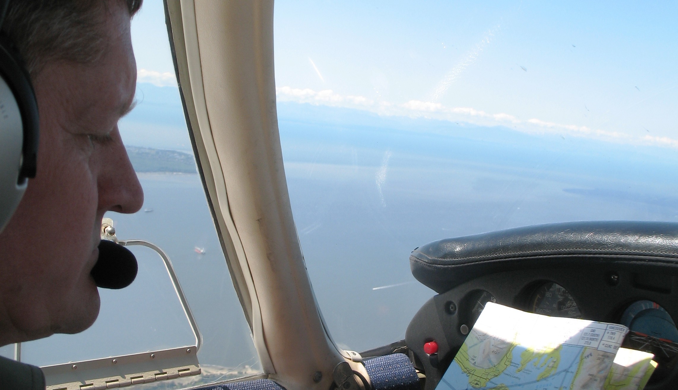 Private Pilot Graduate David Marshall on navigation exercise over the Georgia Strait.  Langley Flying School.