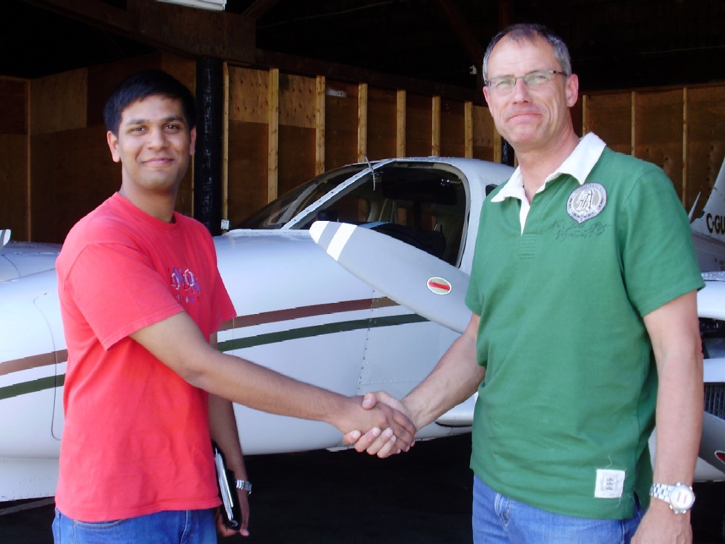 Suraj and Matt after Suraj's Multi-engine Flight Test--satisfaction, achievement.  Langley Flying School.